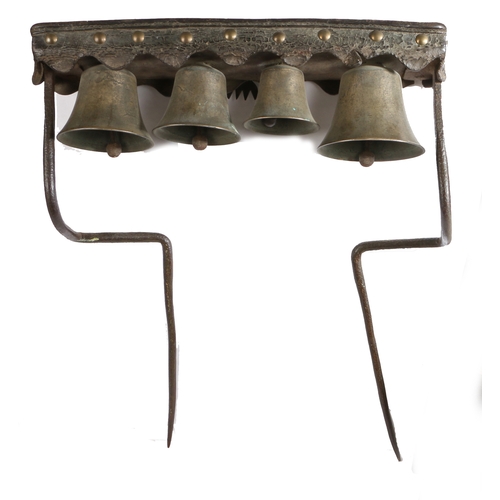 506 - A set of 19th century bronze, iron, timber and leather dray or team bells, English

 With four bells... 