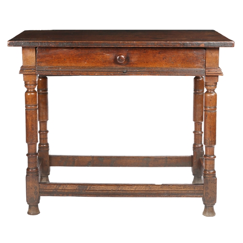 511 - A Charles I oak side table, circa 1640

 Having a twin-boarded top with square-edge, a flush frieze ... 