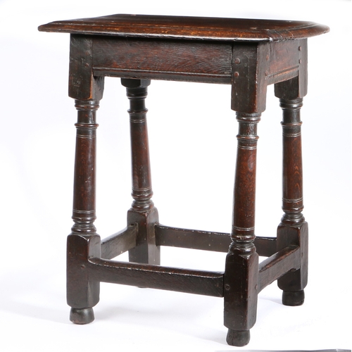 525 - A Charles I oak joint stool, circa 1640

 Having a triple-moulded top, plain rails with lower moulde... 