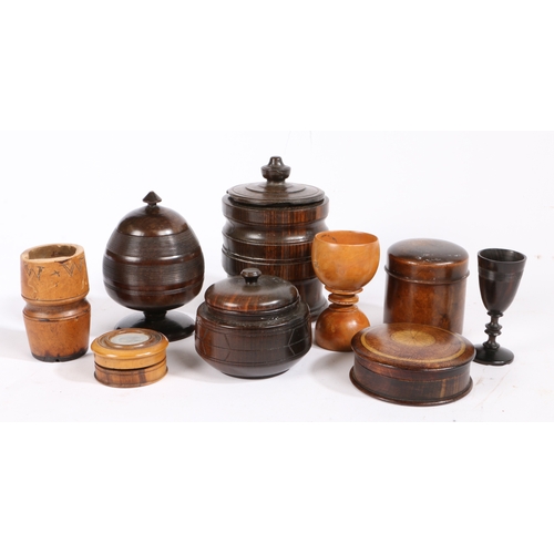 539 - A collection of treen

 To include three tobacco jars and covers, three pots and covers and three sm... 