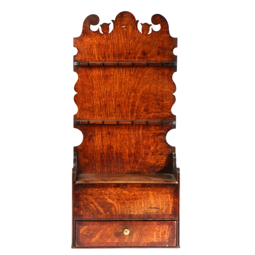 651 - A George III oak and mahogany inlaid spoon rack, Lancashire, circa 1800

 Having a tall one-piece ba... 