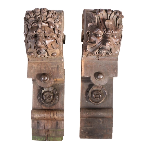 658 - A pair of large 19th century oak corbels, in the 16th century manner

 Each carved with a Green Man ... 