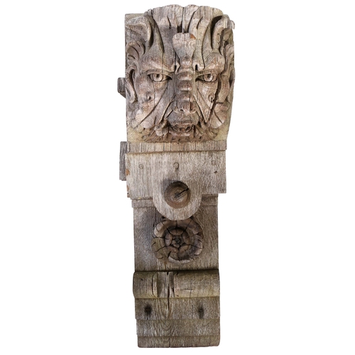 659 - A large 19th century oak corbel, in the 16th century manner

 Carved with a Green Man mask, topped b... 