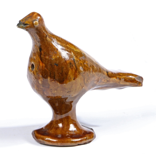 720 - A pottery Halifax slipware whistle, circa 1800

 Designed as a standing bird, 18cm long, 15cm high