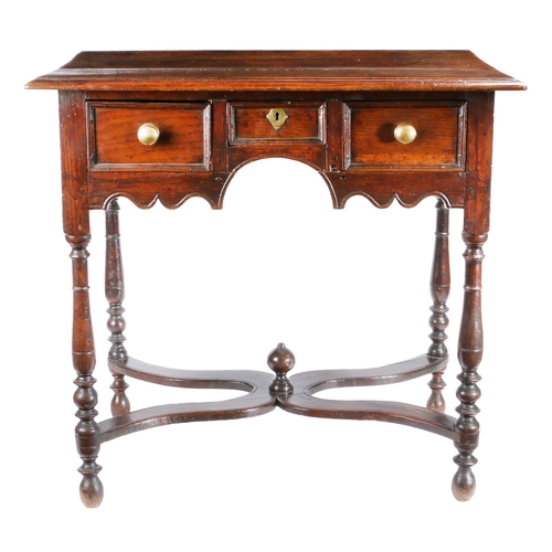 736 - A William & Mary oak side or dressing table, circa 1690

 Having a triple boarded and ovolo-moulded ... 