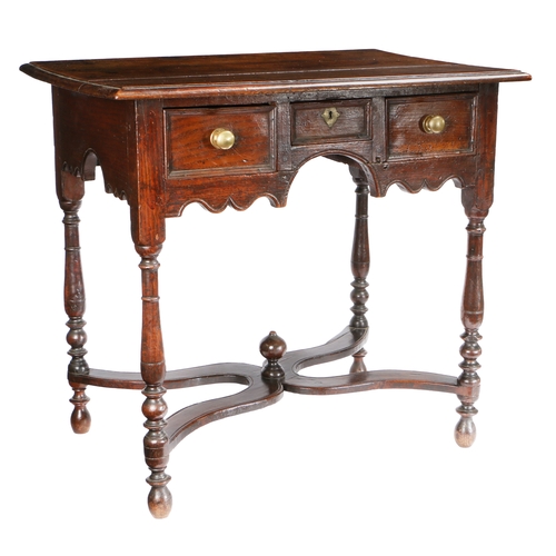 736 - A William & Mary oak side or dressing table, circa 1690

 Having a triple boarded and ovolo-moulded ... 