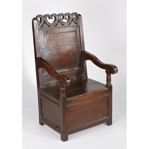 737 - A Charles II oak panel-back and box-seated open armchair, Cheshire, circa 1670

 Having a plain fiel... 