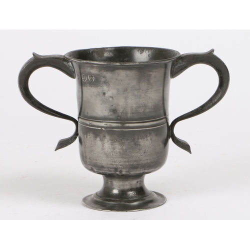 78 - A George II pewter OEWS pint twin-handled footed cup, Yorkshire, circa 1735

 Having a relatively sl... 