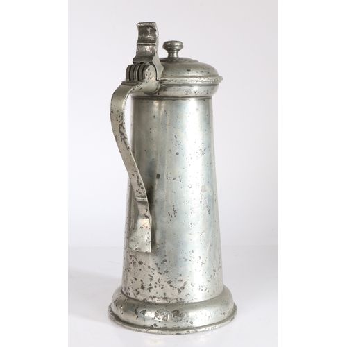 108 - A large James I pewter flagon. circa 1610

 Having a plain straight-sided tapering drum, with ovolo ... 