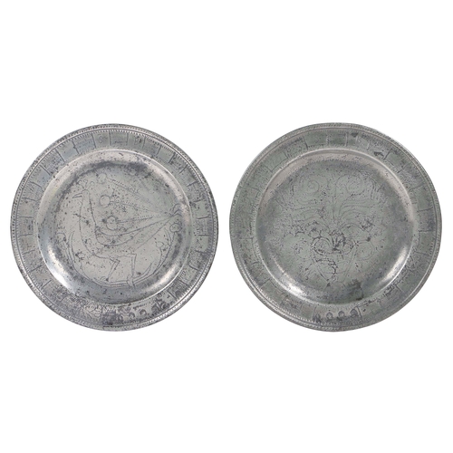 11 - A rare pair of Queen Anne pewter single-reed rim wrigglework marriage plates, circa 1710

 Each rim ... 