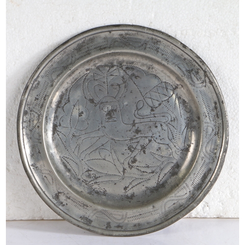 117 - A rare George II pewter wrigglework plate, Hampshire, circa 1735

 Having a single reed rim designed... 