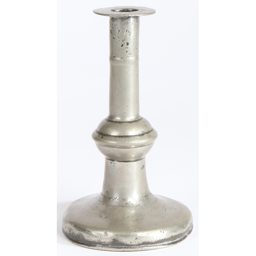 127 - A William & Mary pewter ball-knop candlestick, circa 1690

 Having a broad flat flange, and stem wit... 