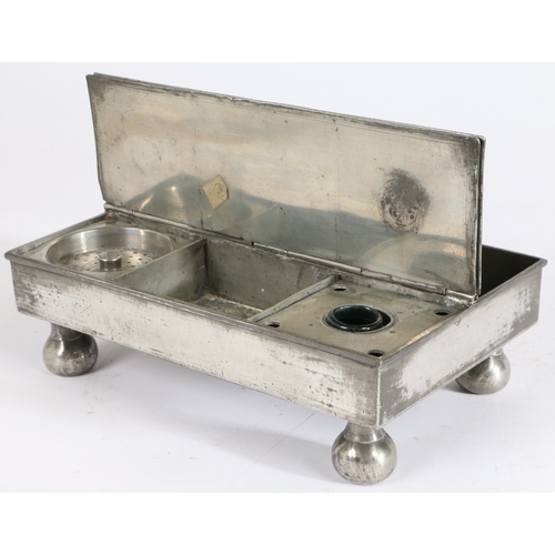 173 - A George III pewter treasury' inkstand, circa 1800

 Of typical flat rectangular twin-flap form, on... 