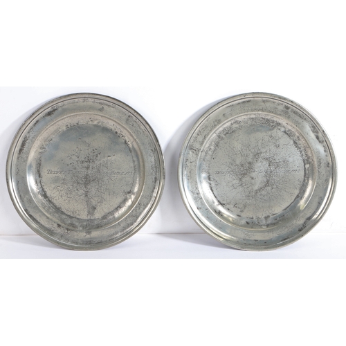 180 - A pair of George I pewter single reed plates, circa 1715

 Each later engraved across the centre of ... 