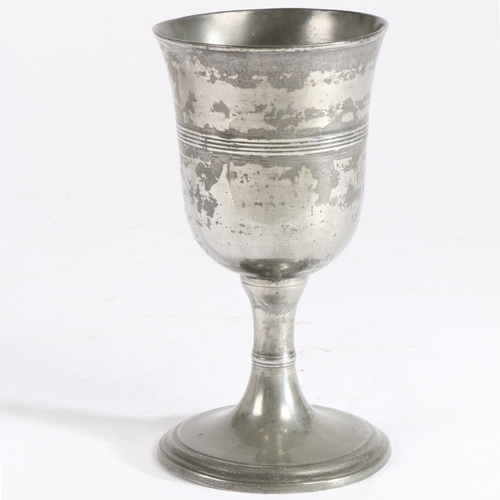 190 - A George III pewter communion cup, circa 1800

 The bowl with flared rim and central multiple-reeded... 