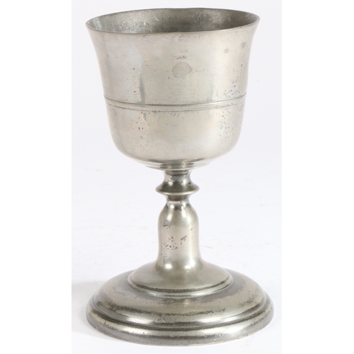 192 - A George II pewter communion cup, circa 1750

 The bowl with flared lip and mid narrow fillet, a dis... 