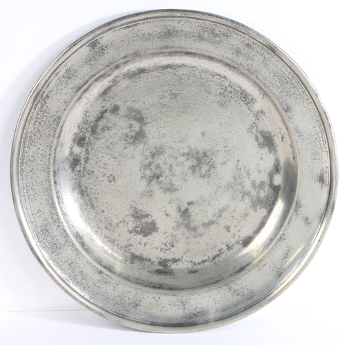 197 - A George II pewter single reed rim dish, dated 1738

 With stamped initials H G above the date 17... 