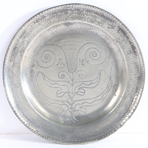 207 - A Queen Anne/George I pewter single reed rim and wrigglework plate, circa 1710-25

 The rim decorate... 