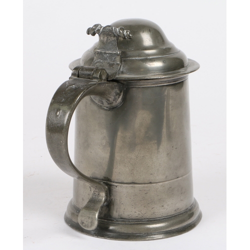 219 - A Queen Anne pewter OEWS quart high domed-lidded tankard, circa 1710

 The straight-sided tapering d... 