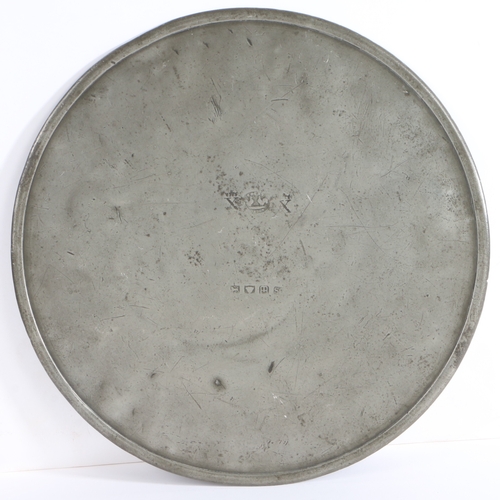 224 - A good early 19th century pewter scale plate, circa 1830-40

 Of typical circular flat form, with re... 