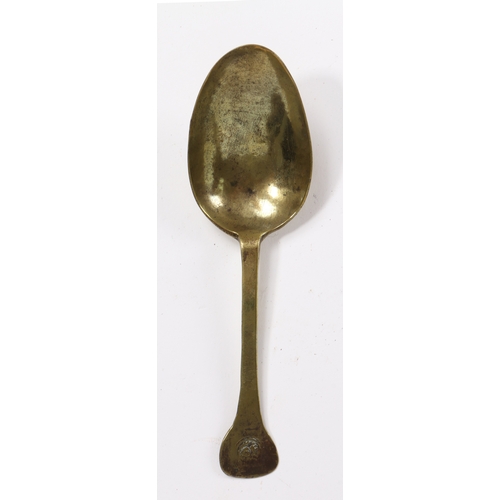 243 - A 17th century brass spoon

 Having a relatively short, flat, broad stem with rounded flat terminal,... 