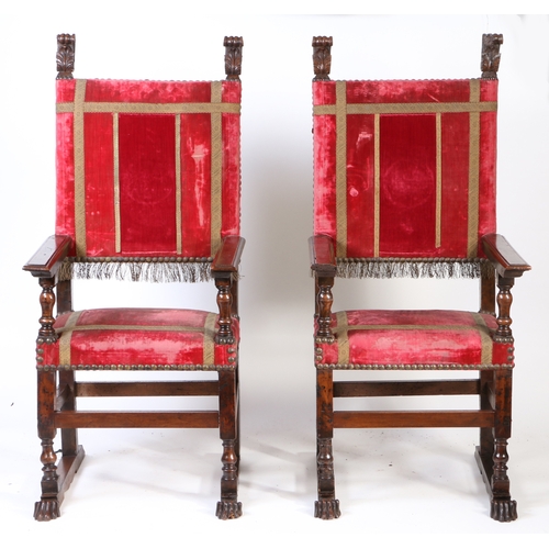 259 - A pair of large late 16th century walnut and upholstered armchairs, French, circa 1600

 Each having... 