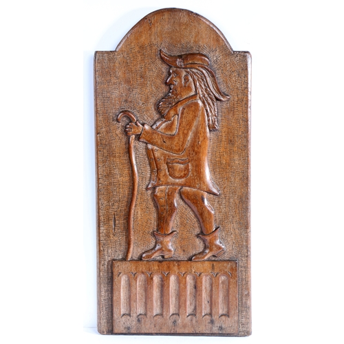 261 - An unusual 18th century carved walnut figural panel, English

 Designed as a gentleman, wearing a fe... 