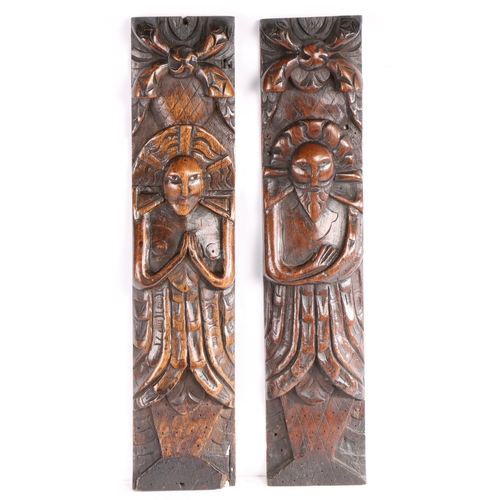 266 - A pair of James I carved oak figural terms, circa 1610

 One male (atlantes) with folded arms, the o... 