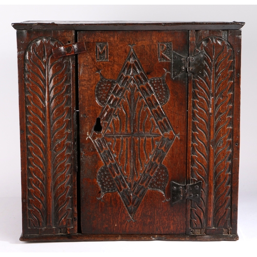 267 - A rare Charles I oak boarded mural cupboard, Gloucestershire/Welsh Borders, circa 1630

 The top wit... 