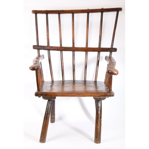 269 - A rare George III ash comb-back primitive Windsor armchair, circa 1800

 The back of seven hand-shap... 