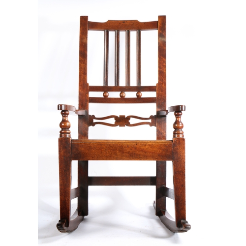 276 - An early 19th century fruitwood, mahogany and alder wood childs rocking chair, East Anglia, circa 1... 