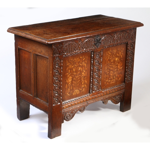 282 - A small James I/Charles I oak and inlaid coffer, Yorkshire. circa 1610-30

 The hinged top off two d... 