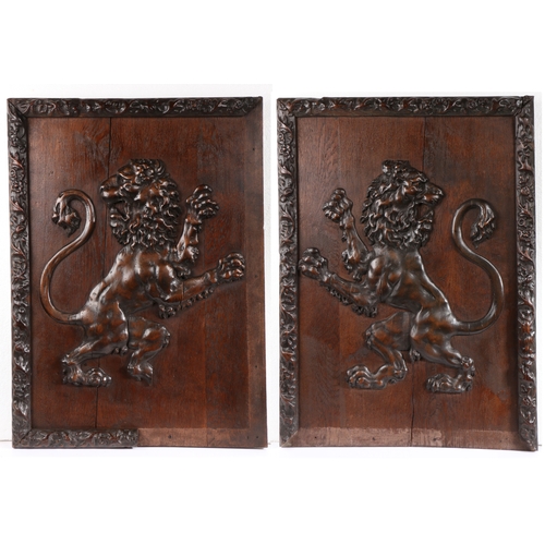 285 - A pair of large early 19th century carved limewood and oak framed lion rampant panels 

 One sinis... 