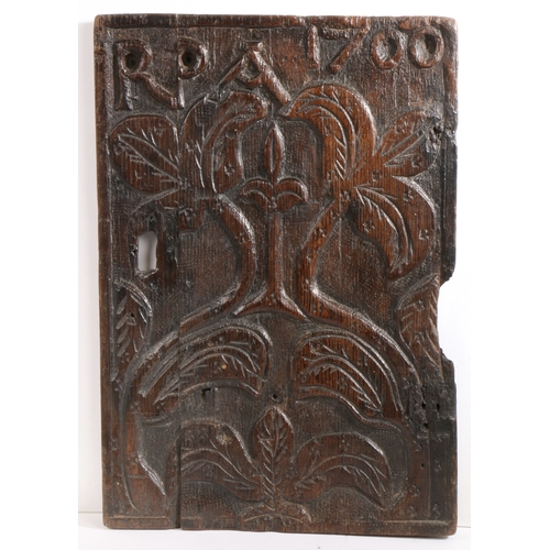 286 - An interesting William III carved oak panel, initialled and dated 1700

 Carved with a pair of leafy... 