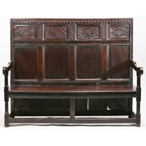 294 - A Charles I oak high-back settle, circa 1640 and later

 The back with a nulled-carved rail, atop fo... 