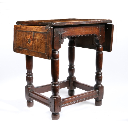 304 - A part Elizabeth I oak and inlaid drop-leaf centre table, circa 1580 and later

 The top geometric i... 