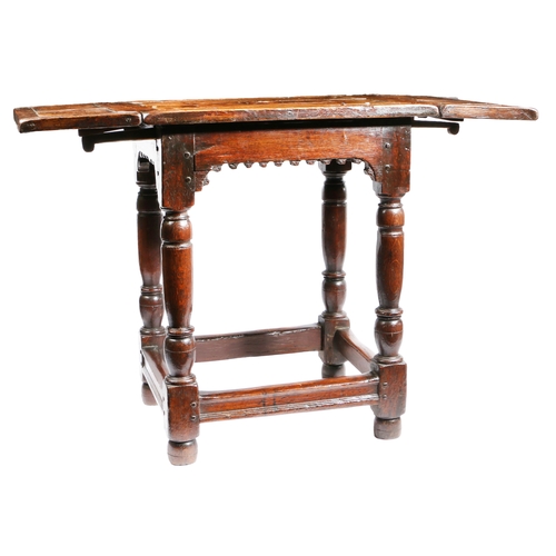 304 - A part Elizabeth I oak and inlaid drop-leaf centre table, circa 1580 and later

 The top geometric i... 