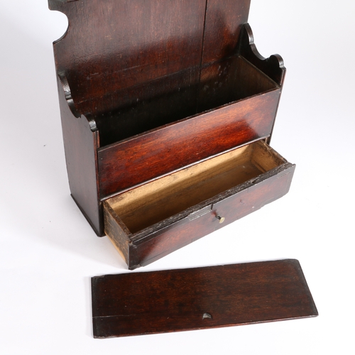 310 - A George III oak spoon and candle box, Lancashire, circa 1790

 The tall backboard with scroll and t... 