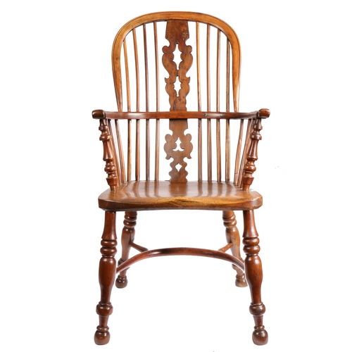 315 - An early 19th century yew high-back Windsor armchair, Nottinghamshire, circa 1830

 The hooped back ... 