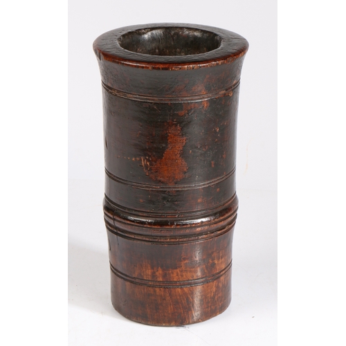 327 - A 19th century sycamore mortar

 Of tall cylindrical form, with low fillet, and slightly flared rim,... 