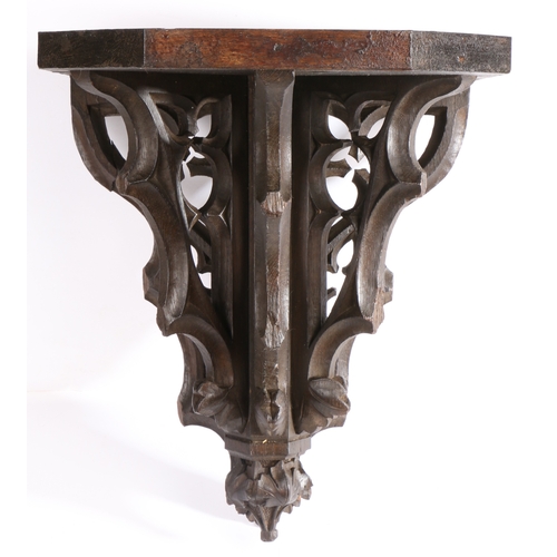 332 - A 19th century carved oak Gothic-Revival bracket, English

 The rectangular top with canted front co... 