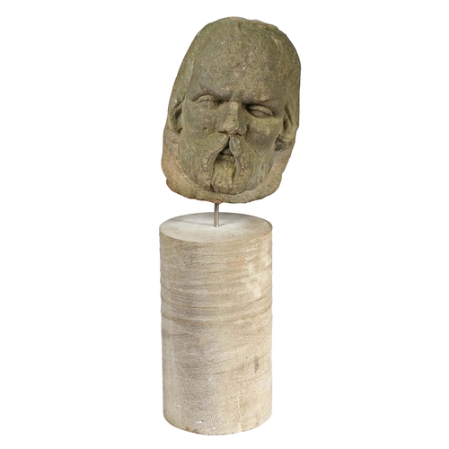 335 - A James I sandstone male head, circa 1620

 Carved with prominent walrus moustache, beard and long... 