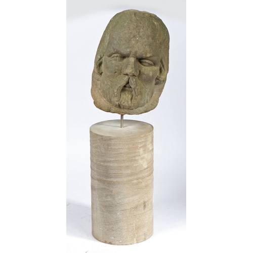 335 - A James I sandstone male head, circa 1620

 Carved with prominent walrus moustache, beard and long... 