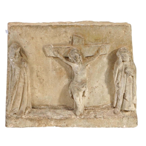 339 - A 17th century carved stone depiction of the Crucifixion

 The central cross and body of Christ flan... 