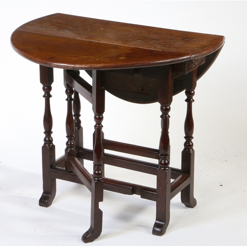 341 - A William and Mary oak gateleg occasional table, circa 1690

 Having an oval drop-leaf top, formed f... 