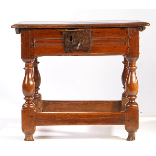 342 - A comparatively large Charles II oak box-stool, circa 1660

 Having a rectangular ovolo-moulded hing... 