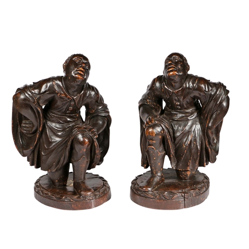 354 - A good pair of 18th century 'ebonised Iimewood blackamoor figures, Italian

 Each designed kneeling... 