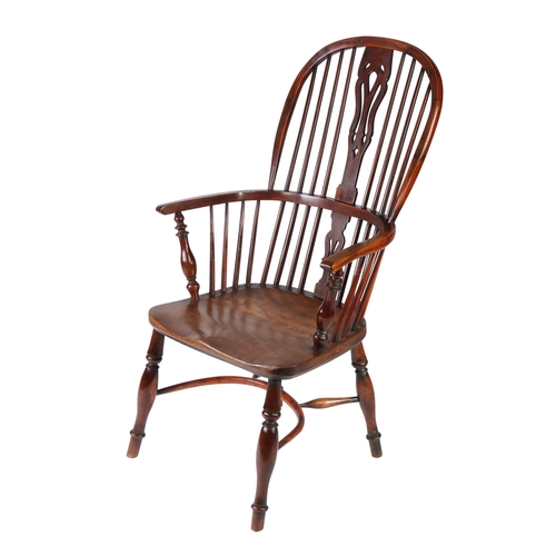 360 - A Victorian yew Windsor armchair, North East Midlands, circa 1850 

The high hooped back with four l... 