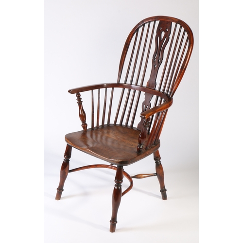 360 - A Victorian yew Windsor armchair, North East Midlands, circa 1850 

The high hooped back with four l... 