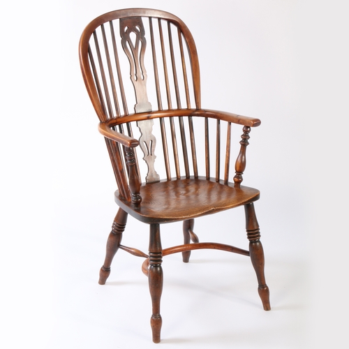 361 - An early Victorian yew and elm high-back Windsor armchair, circa 1840

 The hooped back with four lo... 